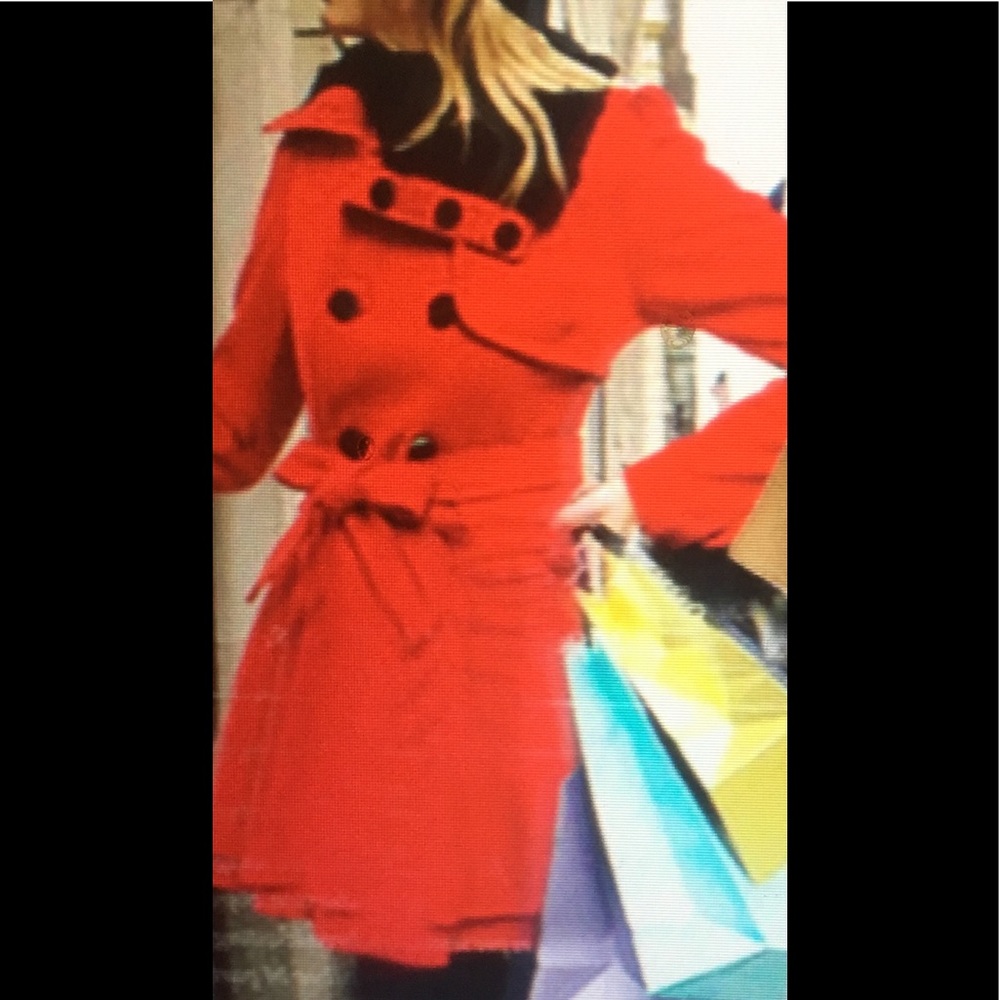 Red jacket with cozy fur collar.